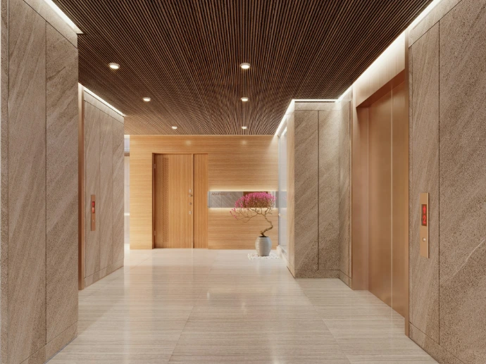 Modern hotel lobby with elevators and wood accents.